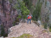 Dona on cliffs below falls