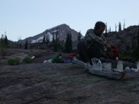 Ian cooking, Mt. MacDonald in background