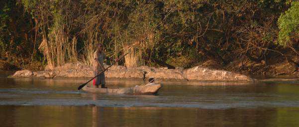 Popa Falls Man In Boat