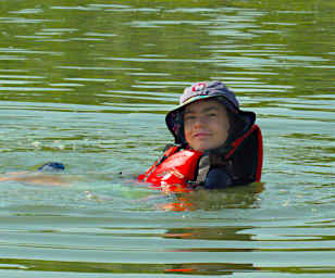Jack Swimming by Canoe