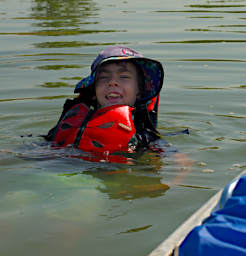 Jack Swimming by Canoe