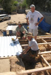 Dafyd, Alfred and Dean putting on the first roofing steel