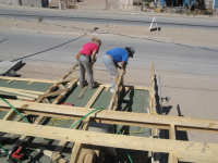 Erin and Jose Luis setting trusses