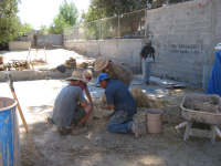 Dafyd, Erin, Bob and Everisto making clay-straw samples