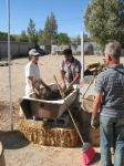 Lauri, Mani and Bob mixing clay-straw samples