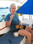 Dona sampling a coconut